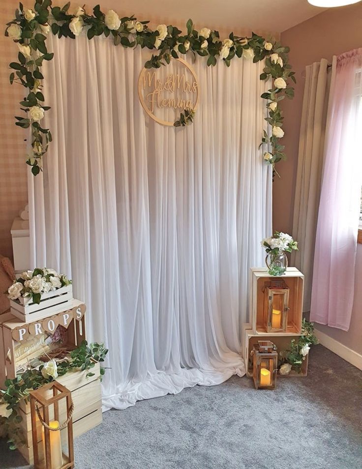 the wedding stage is decorated with flowers and candles