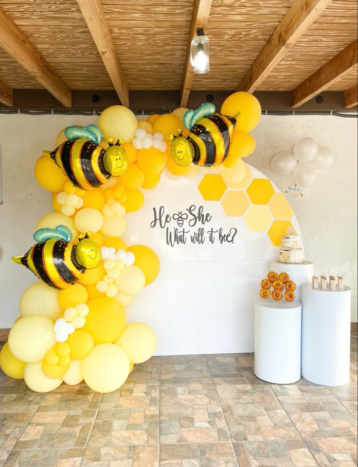 a bunch of balloons that are in the shape of bums and honeybees