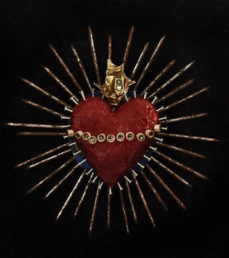 a red heart surrounded by gold spikes