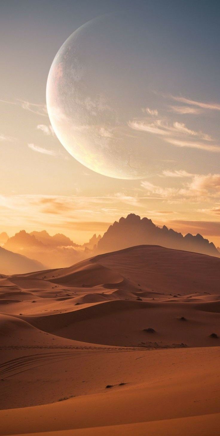 an alien like object is in the sky above sand dunes and mountain tops at sunset