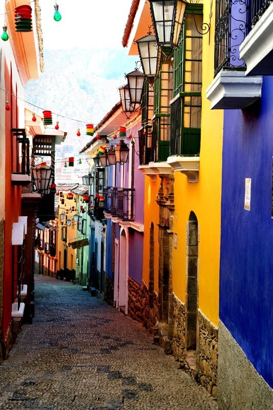 an alley way with many colorful buildings on both sides