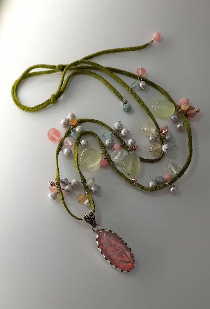 "\"Waiting the buds to flourish\" necklace. Olive-green leather sued cord with a man made opal sterling silver pendant and 57 various gemstone beads. Grey-silver fresh water pearls, pink-salmon tourmaline, pink and large lemon quartz and morganite beads, agate and sterling silver beads are attached along the length of the cord with sterling silver wire.  The pendant is hanging from the sued cord with a sterling silver carved bail and it has an amazing sparkle rainbow array of pink, green and ind Gemstone Pendant Necklace, Fresh Water Pearls, Water Pearls, Lemon Quartz, Gemstone Necklace Pendant, Opal Pendants, Jewelry Inspo, Agate Gemstone, Leather Necklace