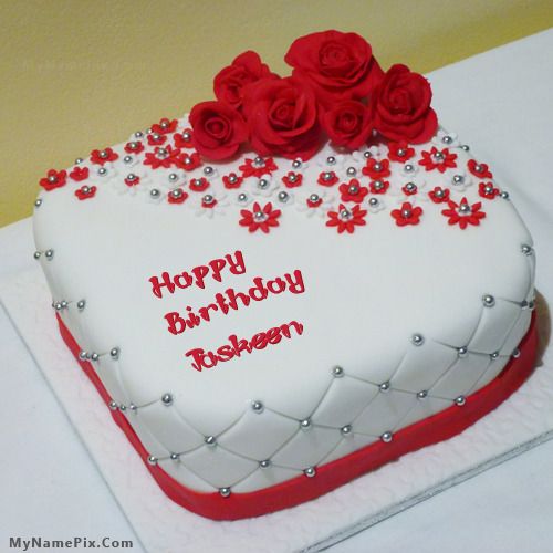 a heart shaped birthday cake with red roses on top