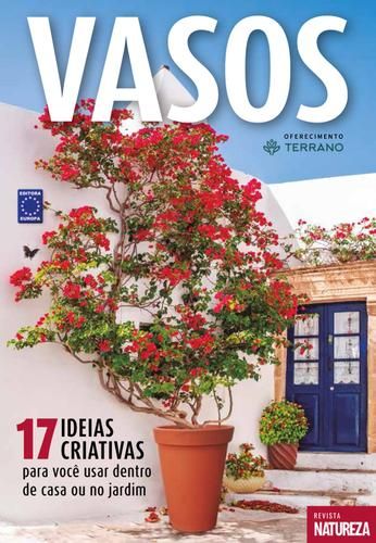 a magazine cover with a potted plant in front of a white wall and blue door