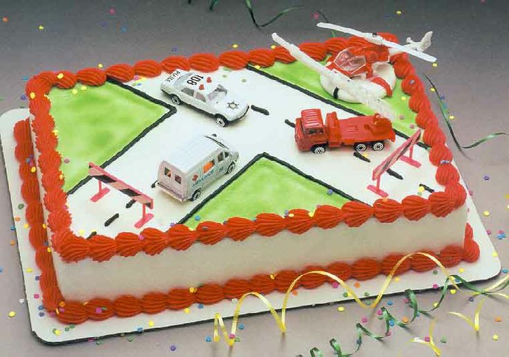 a birthday cake with cars and trucks on it