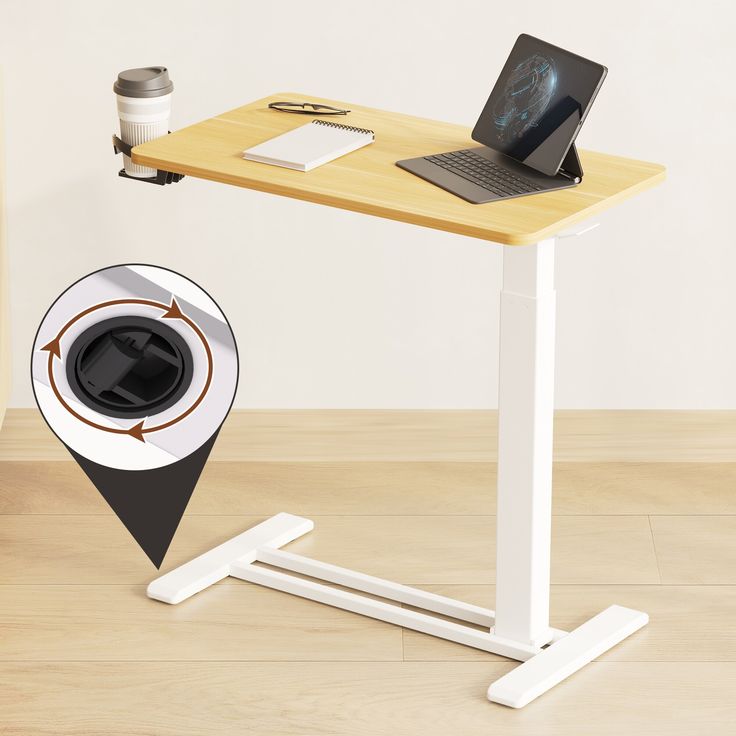 a laptop computer sitting on top of a wooden desk