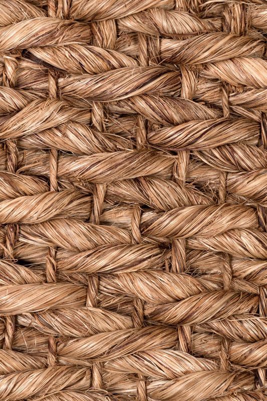 close up view of woven fabric textured with natural colors and pattern, brown color