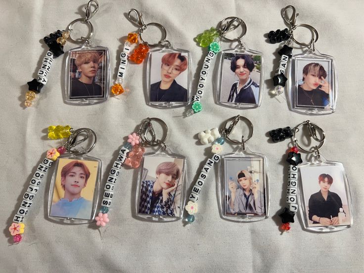 six keychains with pictures of the same person on them