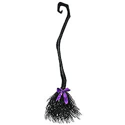 a black and purple broom with a bow on it