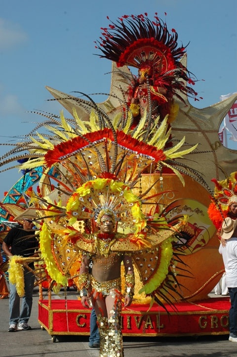 a parade float with people standing around it