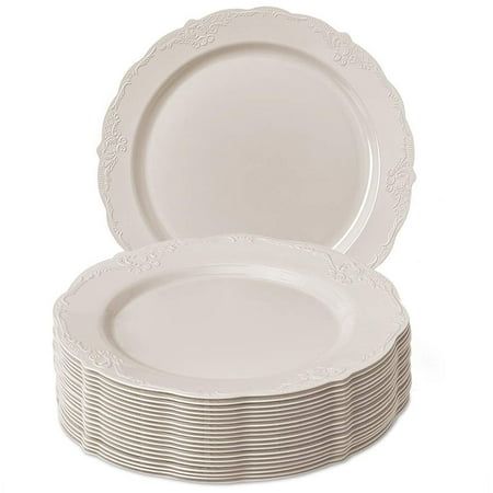 a stack of white plates on a white background