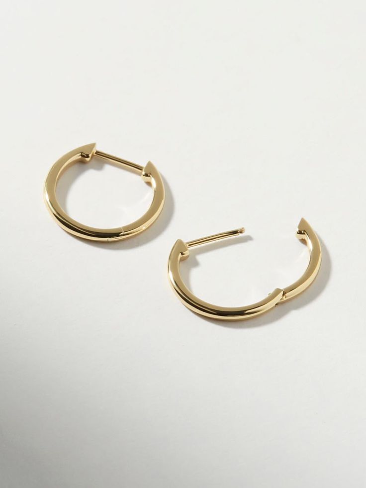 Classic, polished and minimalist-chic, these small slim endless hoops are perfect for everyday wear. Crafted in recycled Sterling Silver and dipped in 14K gold, these hoops come with an endless hoop closure for comfort and ease. Lightweight and hypoallergenic, these small slim endless hoops add a dainty touch to your earring stack. This design is also available in a medium size. • Hypoallergenic hoop earrings crafted in recycled Sterling Silver• High-polish, smooth 14K gold finish • Lightweight, Earring Stack, Bday Gift, Outfit Plan, Minimalist Chic, Earring Crafts, Letter Necklace, Simple Earrings, Recycled Sterling Silver, Precious Metals