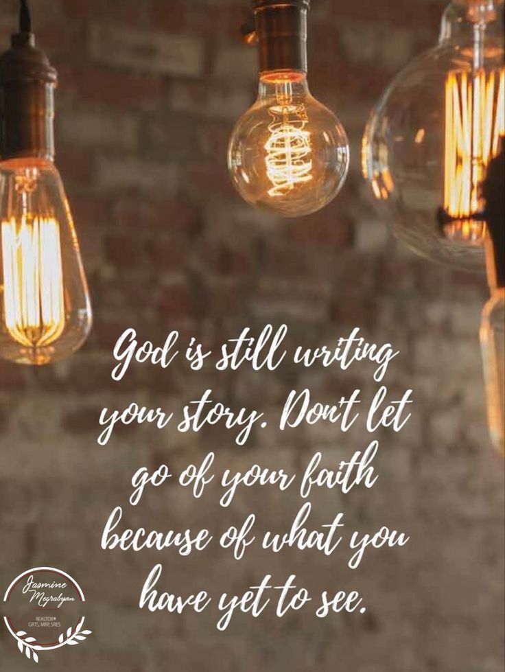 some light bulbs hanging from a brick wall with a quote about god's still writing your story don't let go of your faith because of what you have yet to see