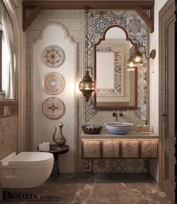 a bathroom with a sink, mirror and toilet in it's centerpieces