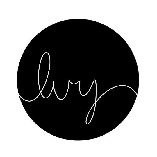 the word joy written in cursive writing on a black circle with white background