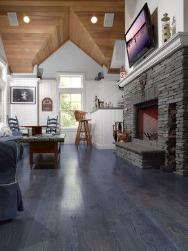 a living room filled with furniture and a fire place