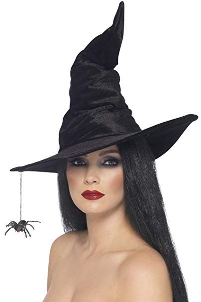 a woman with long hair wearing a witches hat