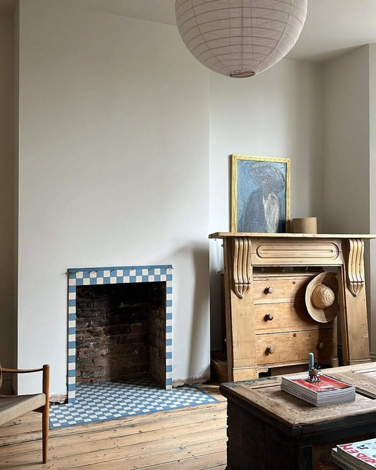 a living room filled with furniture and a fire place in the middle of a room