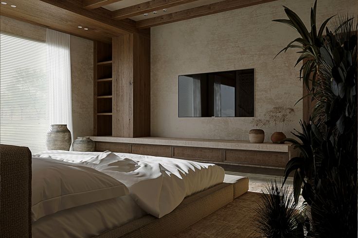 a large bed sitting under a window next to a wooden shelf filled with potted plants