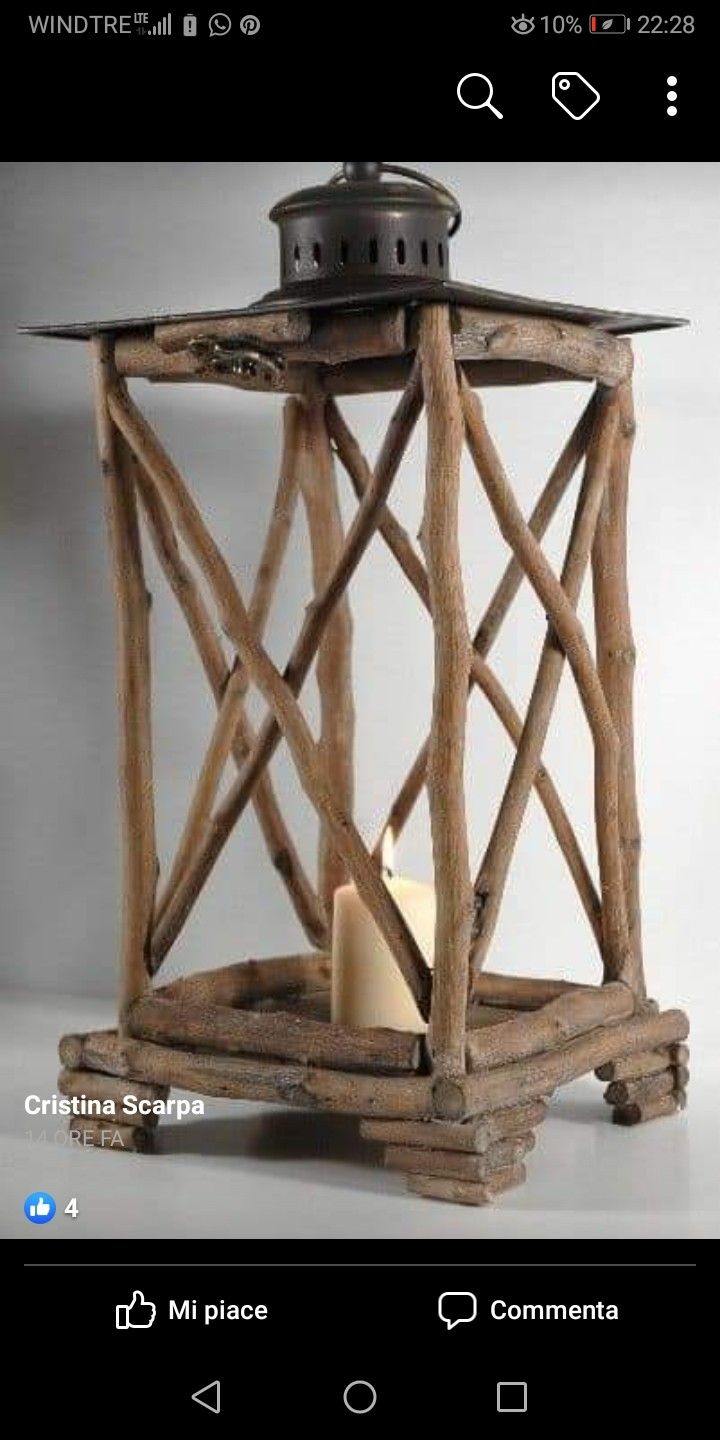 a wooden lantern with a candle in it