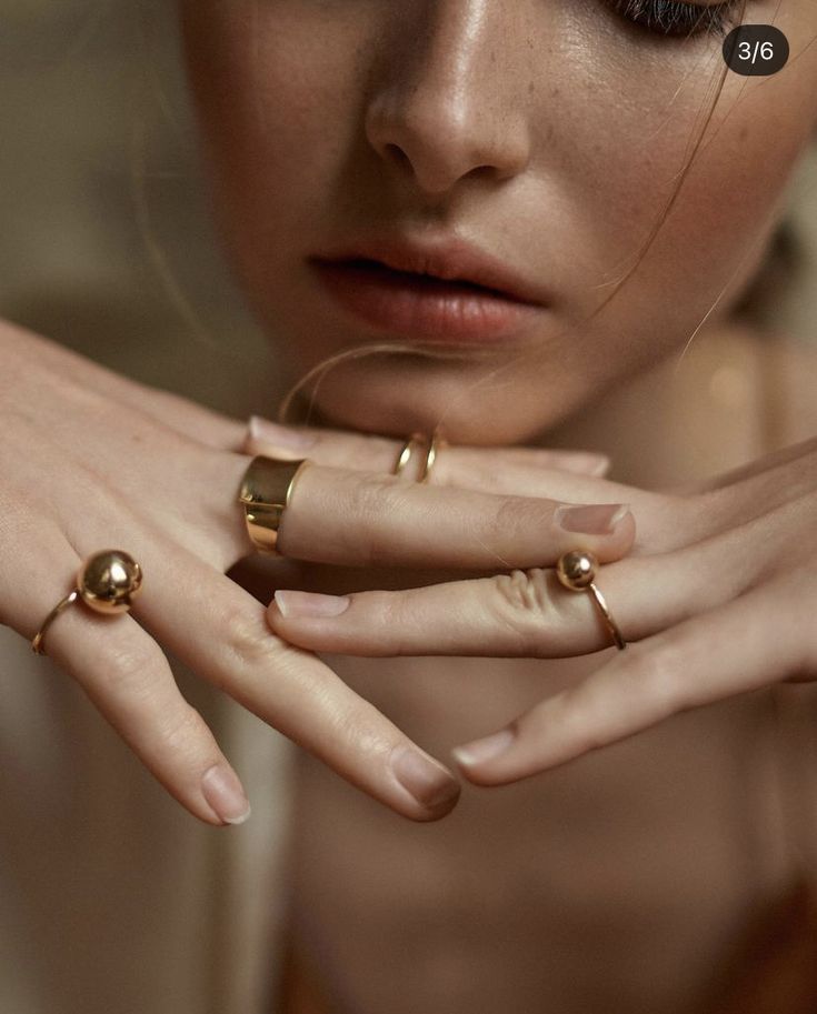 a woman with two rings on her fingers