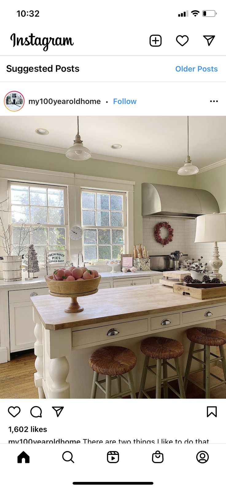 an instagramted photo of a kitchen with two stools in front of the island