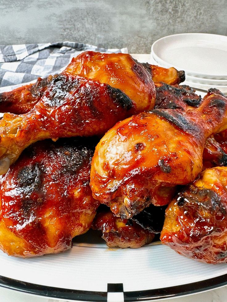 chicken wings covered in bbq sauce on a plate