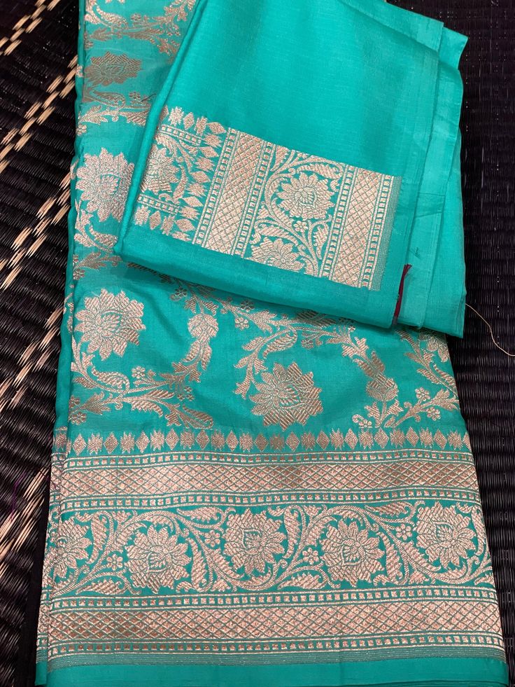 Silk mark certified full Jaal Banaras Saree.It has  beautiful tassels. Blouse is plain with beautiful border. Saree has beautiful sheen and it drapes very nicely. It is a very grand saree making it a perfect choice for wedding like occasions. It is hand woven and silk mark certified. Fall and pico is already done for the saree. Fabric : Pure Katan Silk Ocassion : wedding, Social meets, Gatherings, Parties shipping : Free in USA Luxury Silk Mark Certified Saree For Wedding, Cheap Katan Silk Saree With Pallu Detail, Traditional Drape Cutdana Anarkali Set For Festivals, Eid Cutdana Pre-draped Saree For Puja, Traditional Tussar Silk Pre-draped Saree, Festive Bollywood Handloom Pre-draped Saree, Diwali Katan Silk Pre-draped Saree In Traditional Drape, Festive Pre-draped Saree For Traditional Ceremonies, Traditional Pre-draped Saree With Cutdana For Festivals