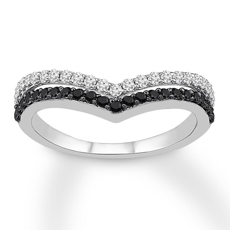 a white gold ring with black and white diamonds