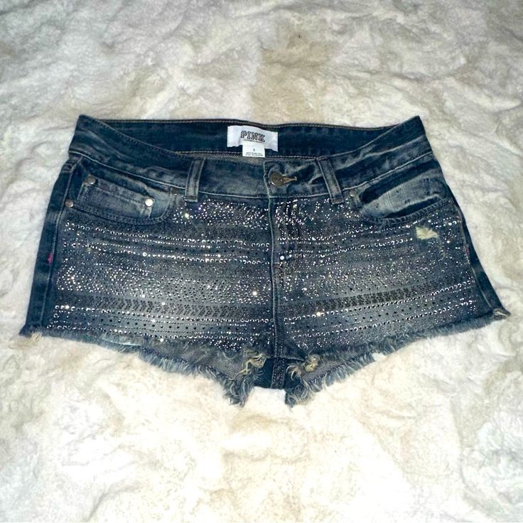 Brand New Without Tags Vs Pink Denim Bling Cutoff Shorts Size: 8 *But These Fit Like A Size 4) Condition: New Without Tags. Have Had For A Few Years In Storage- Bc They Were Too Small- So Never Worn. Retail: $ 69.99 Vs Pink Denim Short Cutoff Shorts 5 Pocket Style (3 In Front & 2 In Back) Rhinestone Embellishments Pink In Dark Blue Threading On Back Rare/H2f No Longer Made Slightly Distressed Style Size Tag Says 8- But These Fit Like A Size 4 Approx Measurements Across: Laying Flat: 15.5” *Pleas Silver Bottoms With Built-in Shorts, Casual Silver Denim Bottoms, Trendy Silver Short Bottoms, Blue Rhinestone Shorts, Bling Shorts, Bestie Outfits, Pink Denim Shorts, Studded Denim, Pink Denim