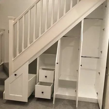 an under the stairs storage unit with drawers