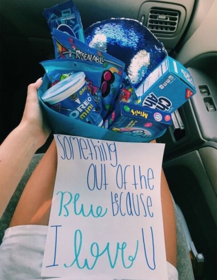 a person holding a sign in their car with the message i love you on it