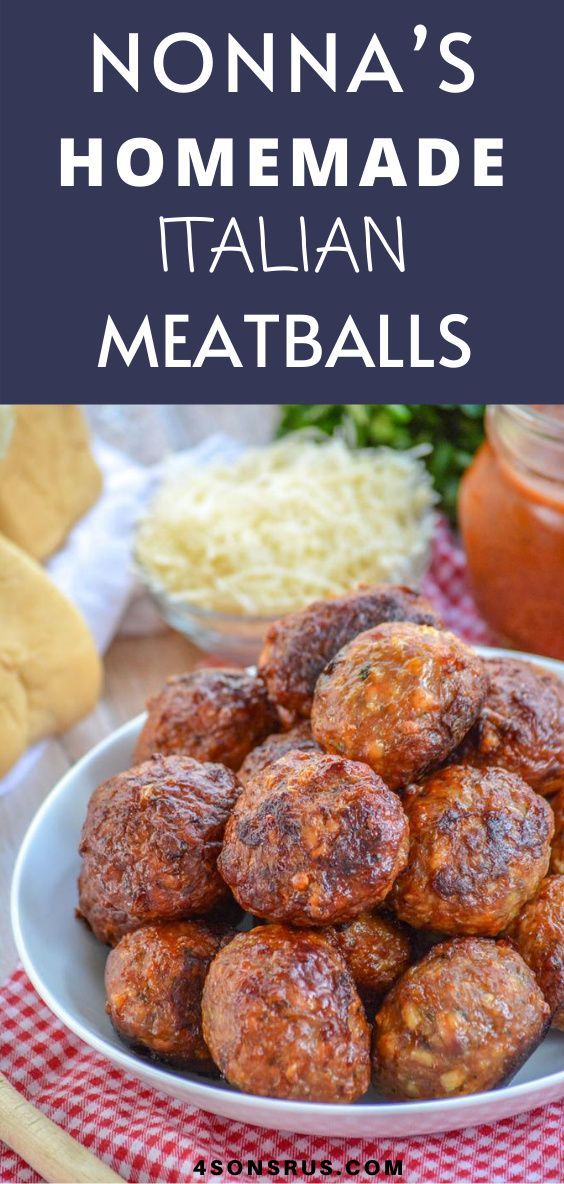 a plate full of meatballs next to some bread