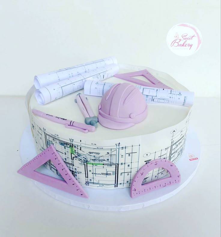 a cake with construction themed frosting on it's top and decorations around the edges