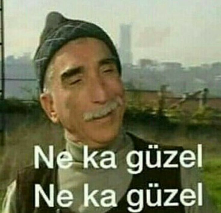 an old man with a mustache is standing in front of a sign that says, ne ka guzel ne ka guez