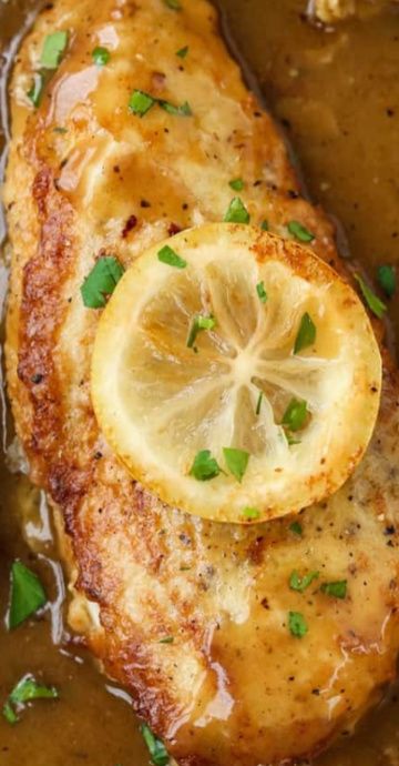 chicken with gravy and lemon served in a pan