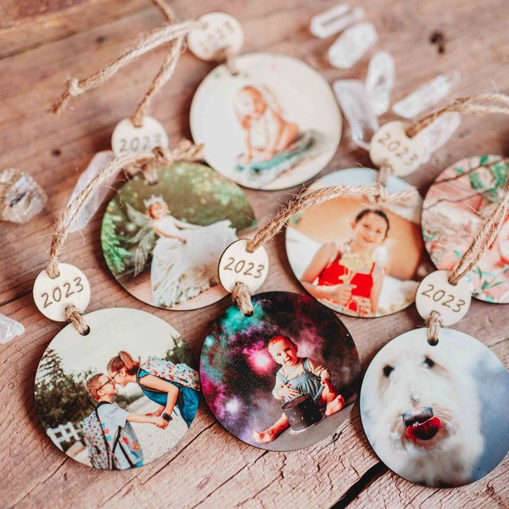 a collection of personalized ornament hanging on a wooden table