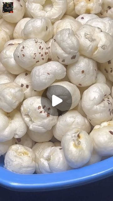 a blue bowl filled with lots of white food