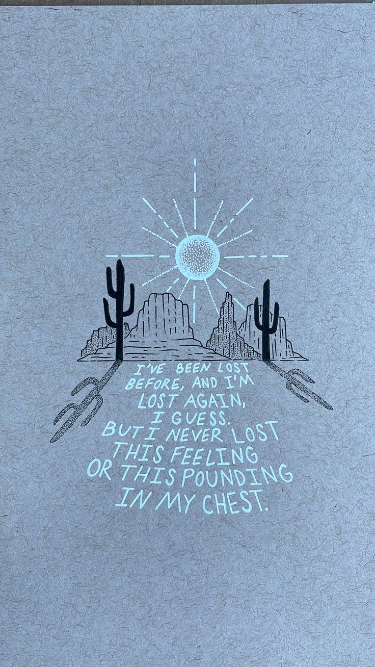 a drawing with words written on it in the middle of mountains and cactus trees behind them