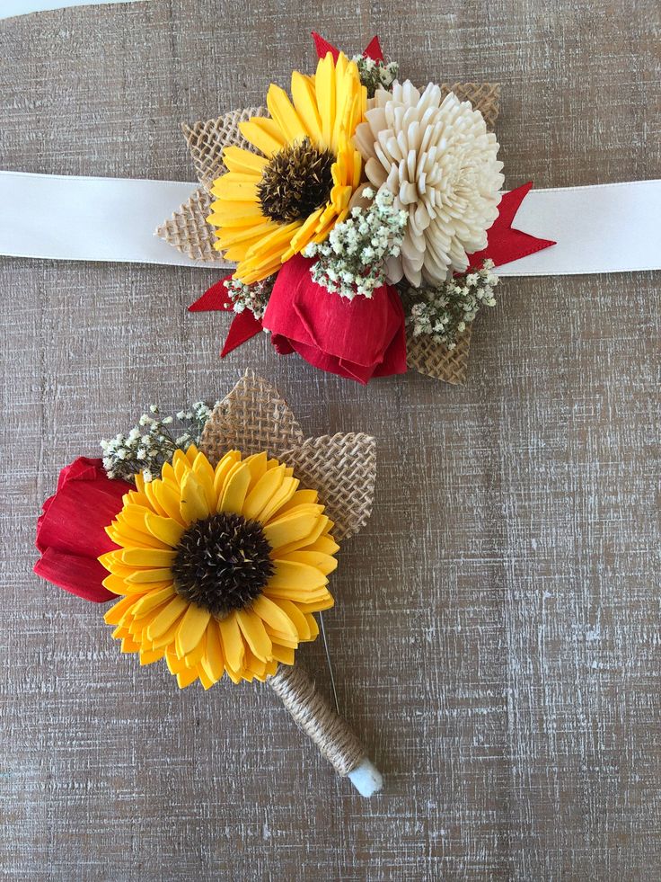 two sunflowers are tied to burlock and placed on top of each other