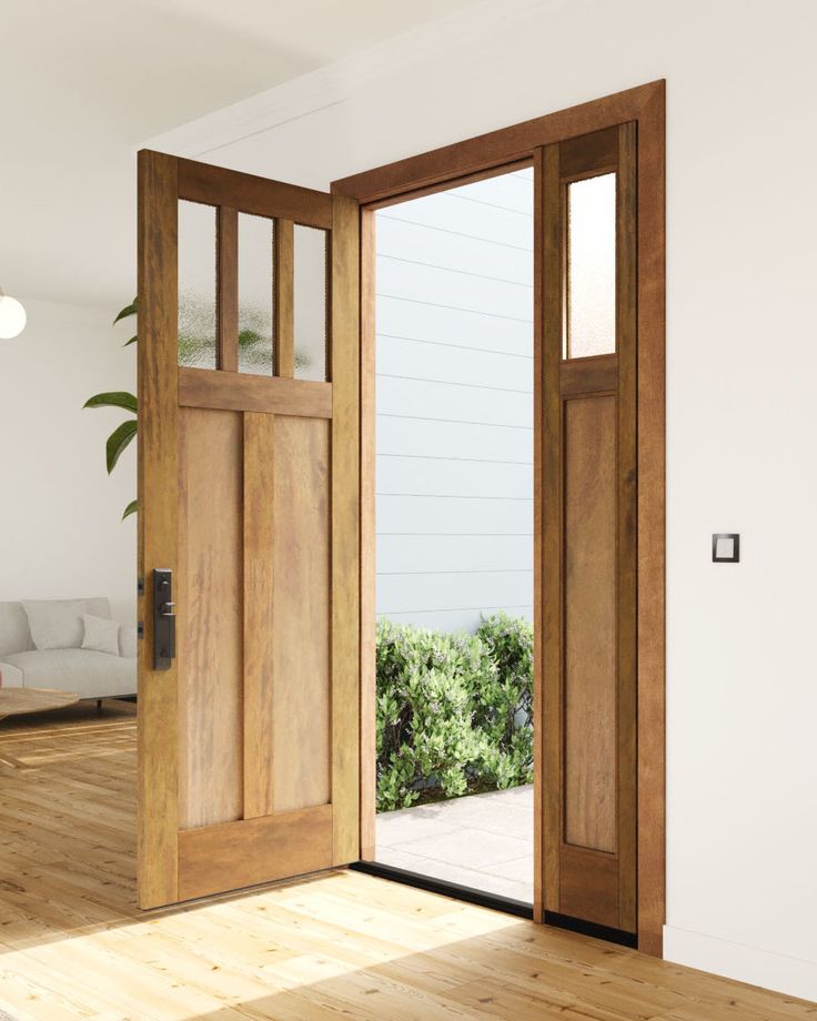 an open wooden door in a white room