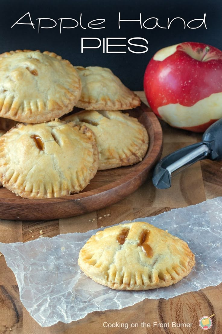 apple hand pies sitting on top of a wooden table