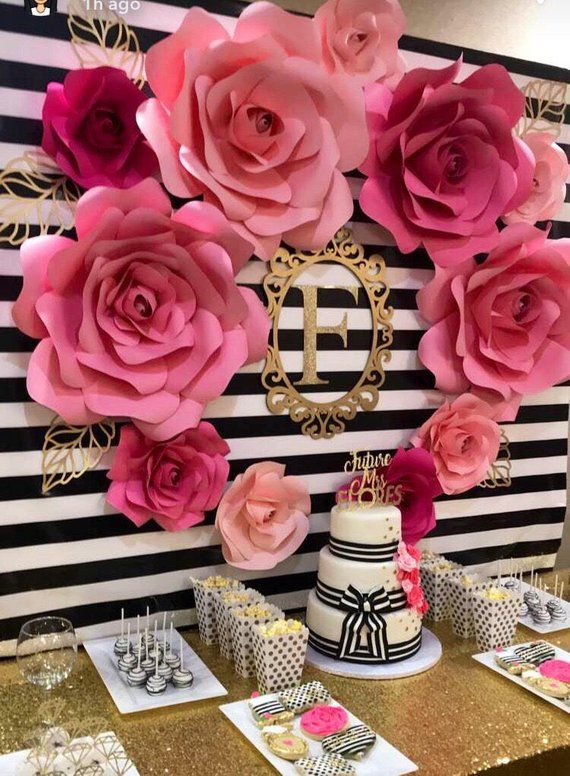 an instagram page with pink flowers on the wall and black and white striped background