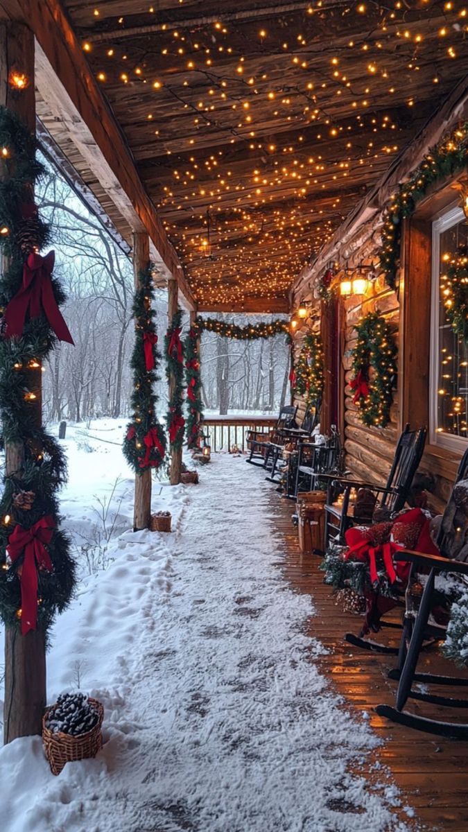 a porch covered in snow with christmas lights on the ceiling and rocking chairs lined up