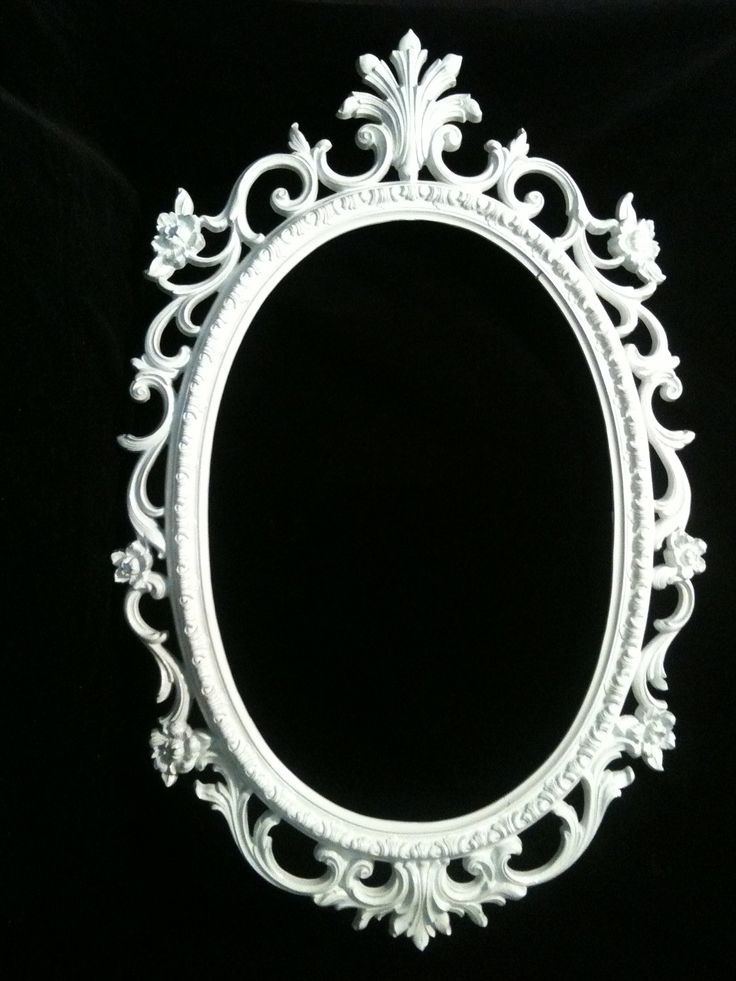 an ornate white frame on a black background