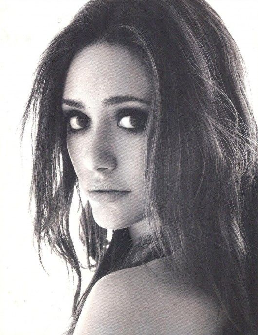 a black and white photo of a woman with long hair