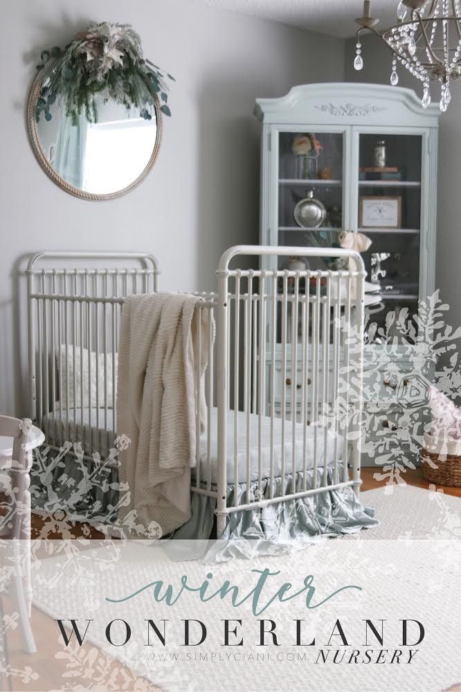 a white crib in a baby's room with the words wonderland written on it