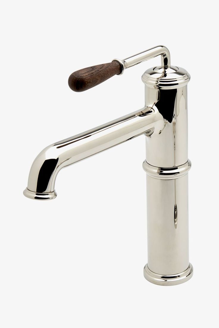 a chrome faucet with a wooden handle