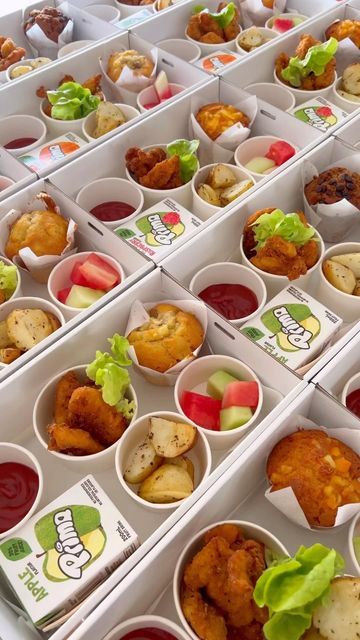 several trays filled with different types of food