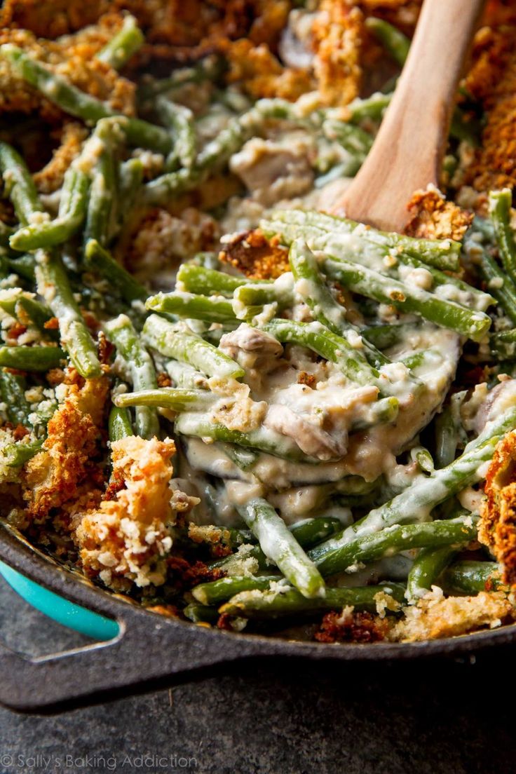 green bean casserole with chicken and parmesan sauce in a skillet